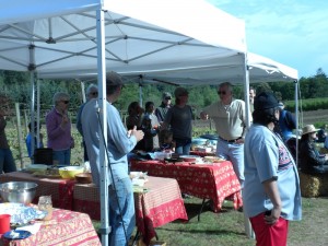 Earlier this year, Friends of the Farms hosted its annual meeting and potluck at the Day Road farms (see photo). The upcoming Farm-to-Table Dinner will occur on the site of the Farmers Market by City Hall.